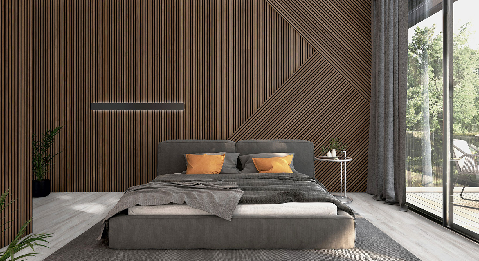 Moderne Schlafzimmerwand aus Akustikpaneelen mit integrierter Beleuchtung, davor ein graues Doppelbett mit orangefarbenen Kissen.